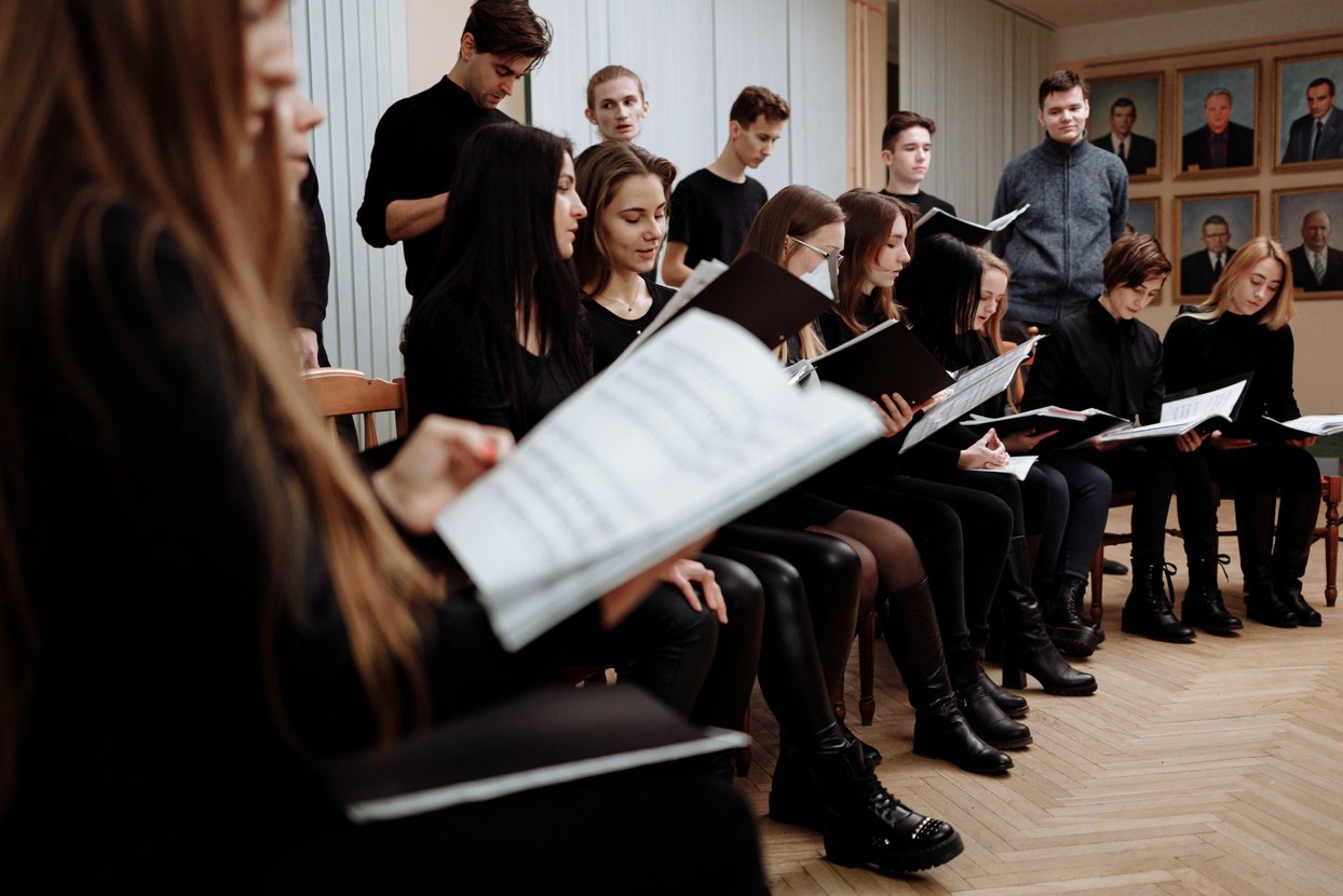 People in Black Clothes Reading